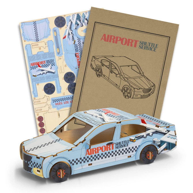 A wooden model of a sedan car in blue and white, accompanied by assembly instructions and a branded card.