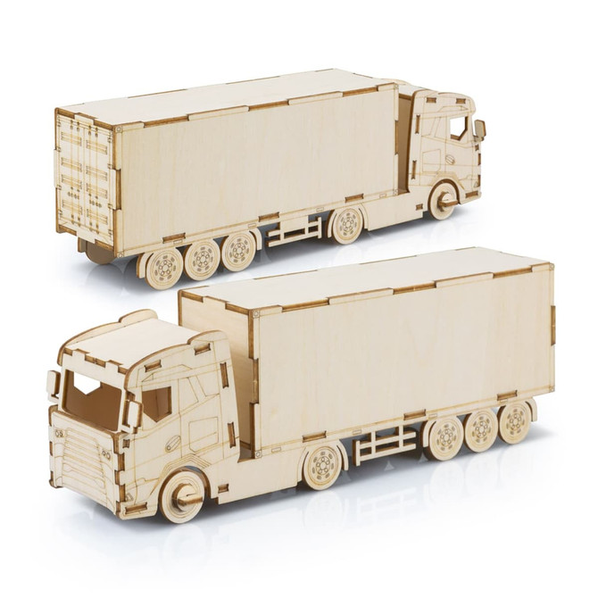 A wooden model of a large truck, featuring detailed engravings and a light wooden finish. The truck has wheels and a container.