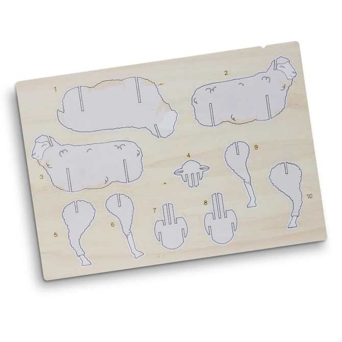 A wooden model kit featuring sheep-shaped pieces, with outlines for assembly, in a natural wood colour.
