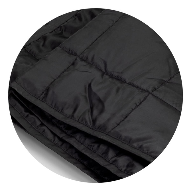 A black puffer blanket with a quilted texture, featuring a smooth, shiny surface and folds. Includes branding.