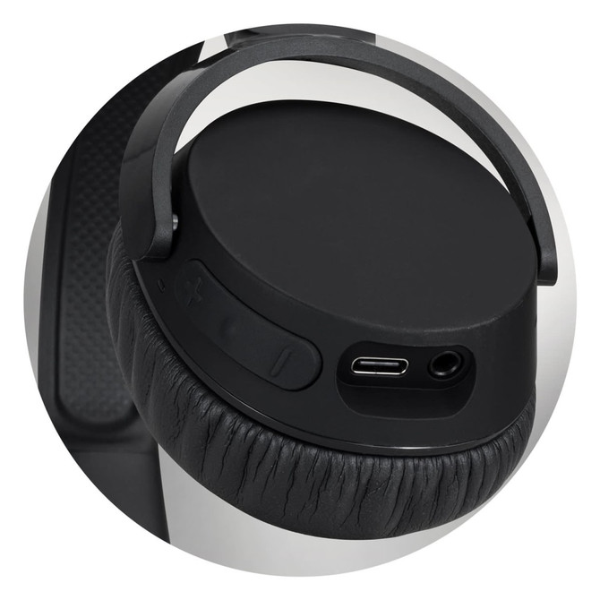 A close-up of black Skullcandy Riff 2 wireless headphones showing the earcup, buttons, and charging port.