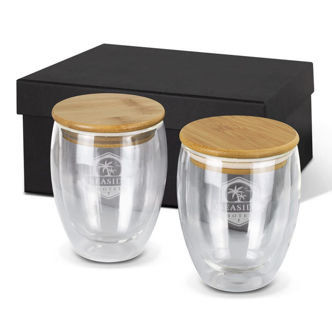 A drink bottle set featuring two clear glass cups with bamboo lids, presented in a black gift box.