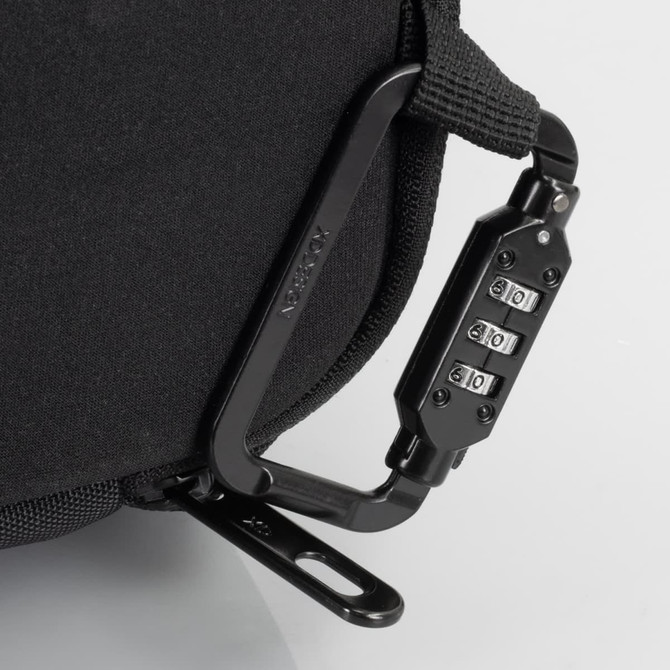A black anti-theft backpack briefcase featuring a combination lock and sturdy attachment clip.