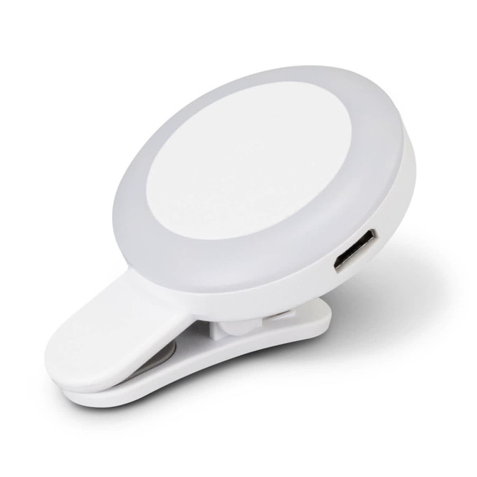 A white Halo Selfie Light with a clip-on feature and a circular design, including a USB charging port.