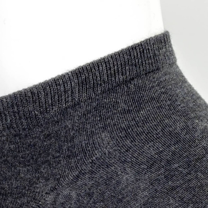 A pair of grey ankle socks, featuring a ribbed cuff and soft texture. The image highlights the sock's upper section.