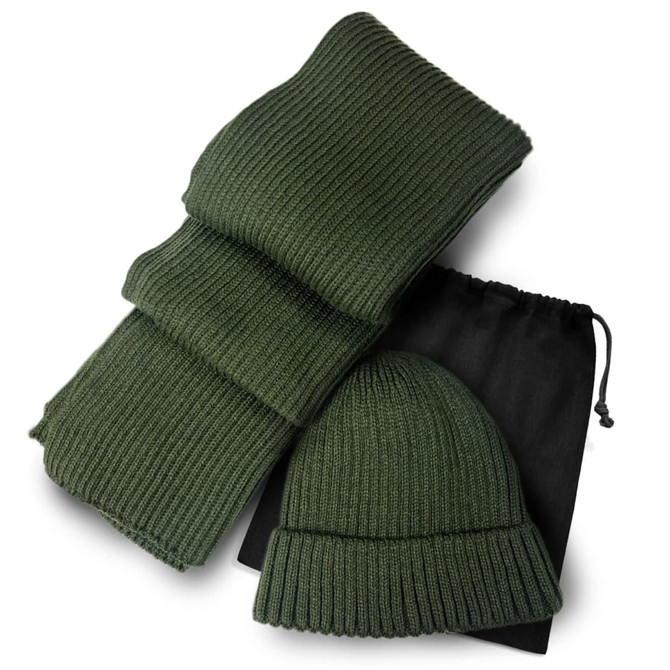 A green ribbed scarf and matching beanie set, neatly arranged with a black drawstring bag.