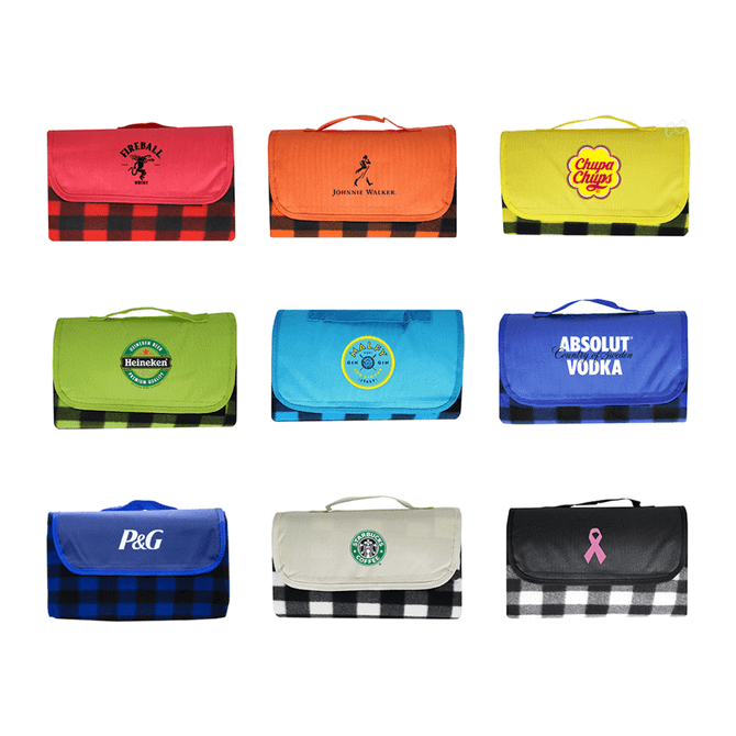 A variety of picnic blankets in bright colours and patterns featuring different logos and brand designs.