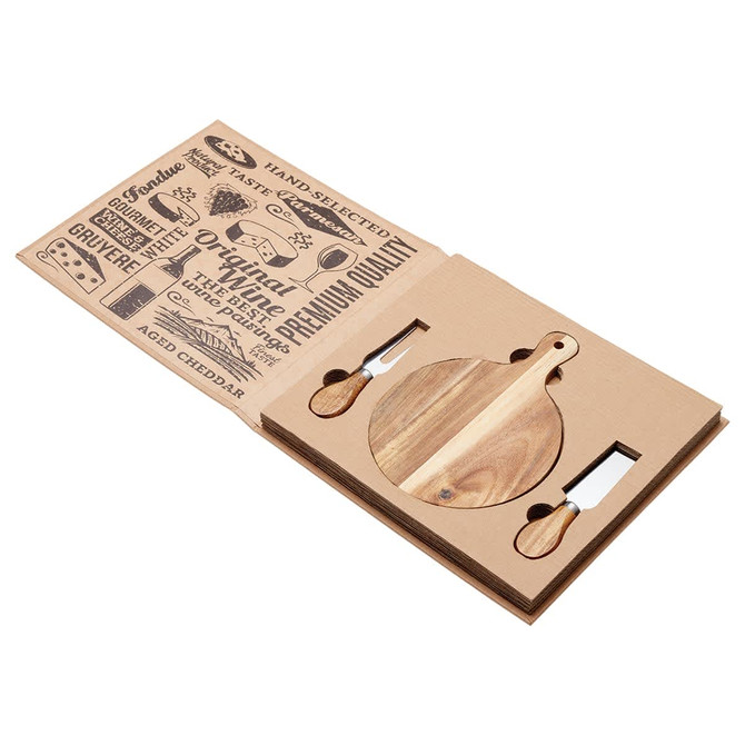 A round wooden cheeseboard with two cheese knives, displayed in a cardboard presentation case featuring various designs.