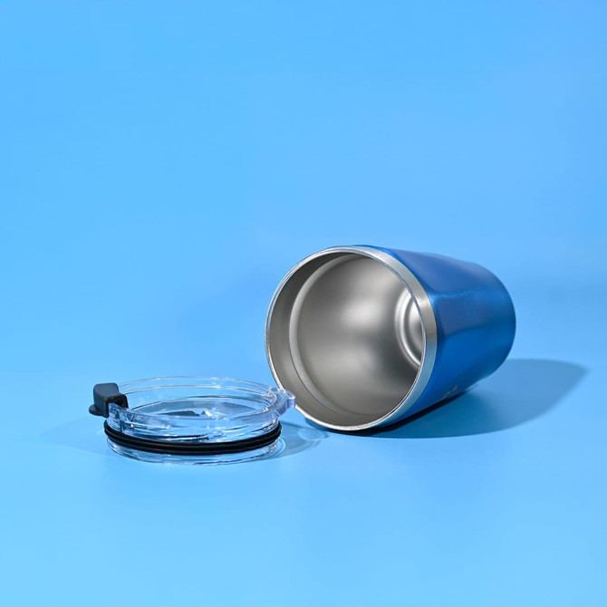 A drink bottle featuring a blue exterior and a removable clear lid, designed for travel use.