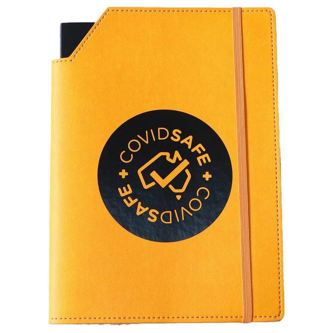 A yellow leatherette notebook cover with a black circular logo and an elastic band closure.