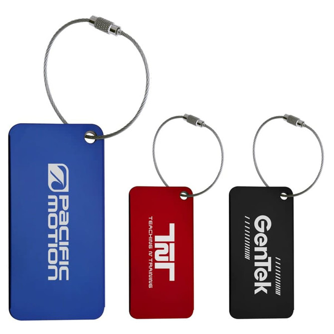 Three metallic luggage tags in blue, red, and black, each attached with a silver cable. All feature logos.