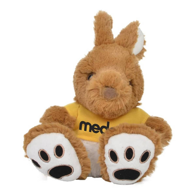 A plush kangaroo toy in brown with white paws, wearing a yellow shirt and featuring a logo on it.