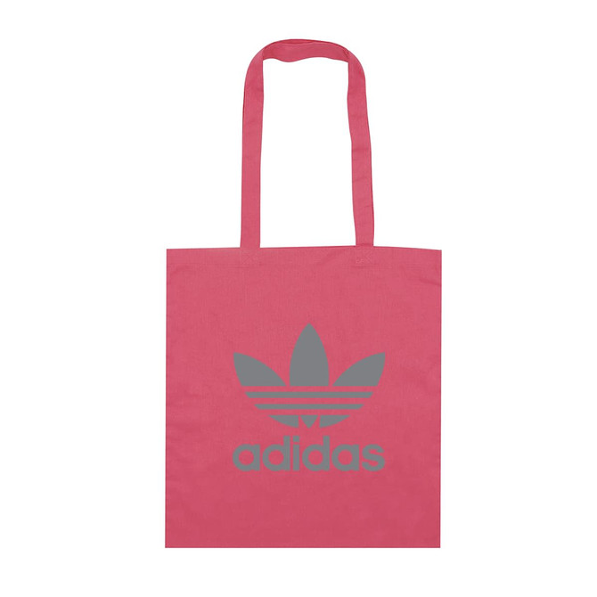 A pink tote bag with a grey logo and two handles. The bag features a simple, minimalist design.