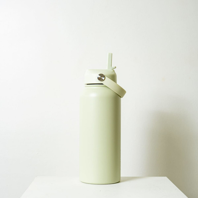 A drink bottle in a light green hue with a flip-top lid and a metal loop for easy carrying.