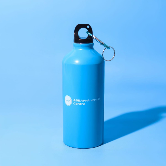 A drink bottle in bright blue with a keyring attachment and a logo on the side.