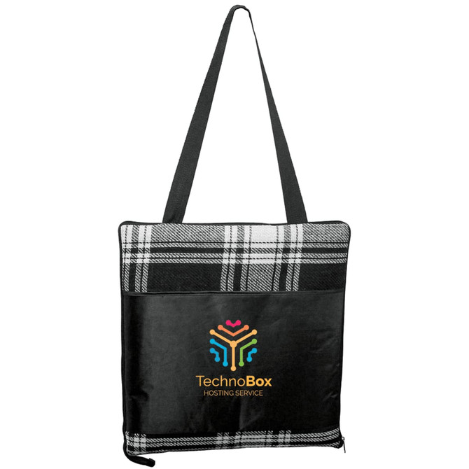 A large picnic rug in black and white plaid, featuring a logo on the front and a carrying strap.