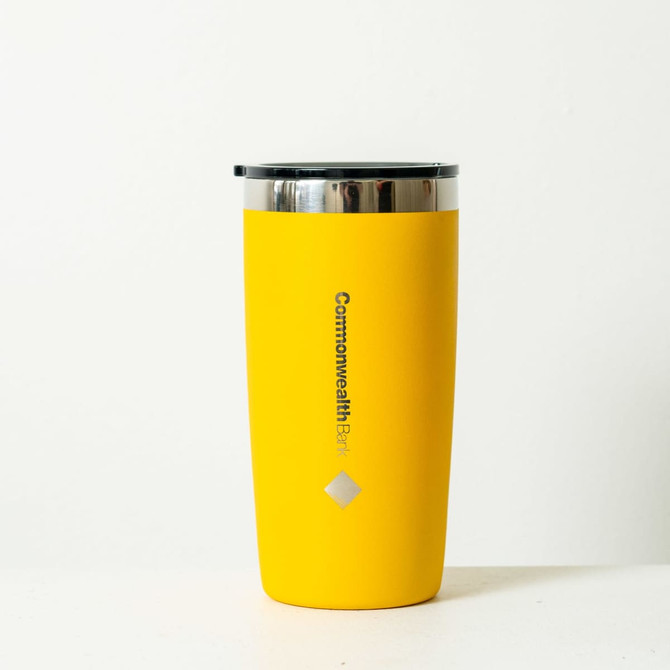 A drink bottle in bright yellow with a stainless steel lid and a logo featured prominently.