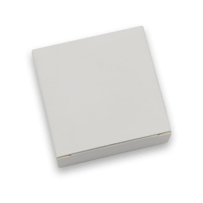 A white, closed packaging box designed for the Rhom Charging Dock, featuring a simple, clean design.