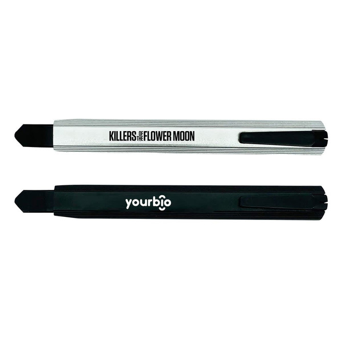 A silver and black slimline retractable box cutter featuring a logo on each side.