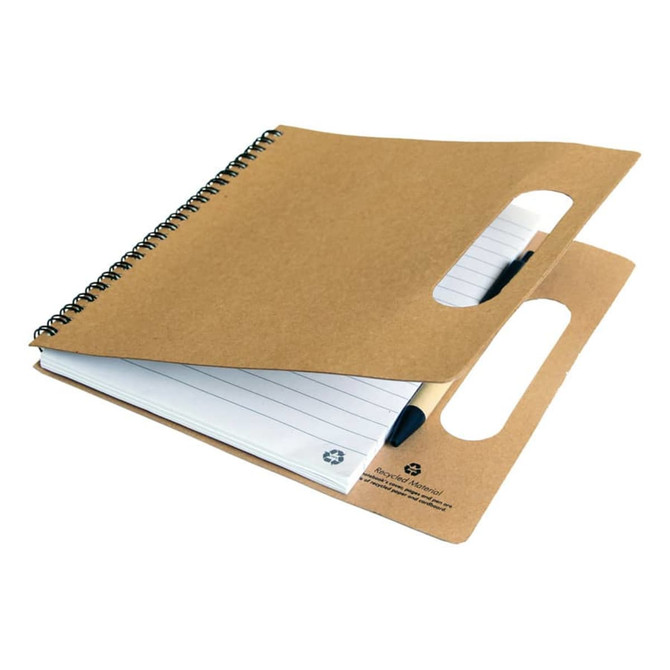 A recycled notebook with a brown cover, spiral binding, and handle cutouts, containing lined pages and a black pen.