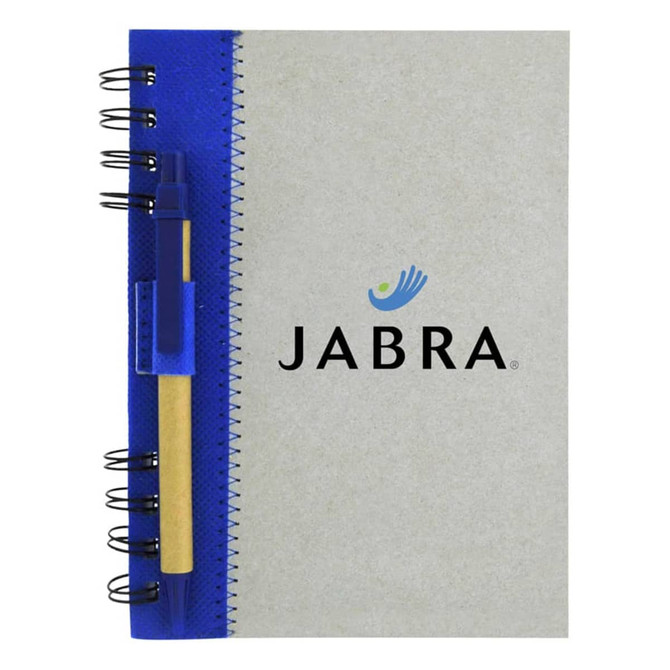 A recycled journal book with a grey cover, blue binding, and a pen attached to the side. Features a logo on the front.