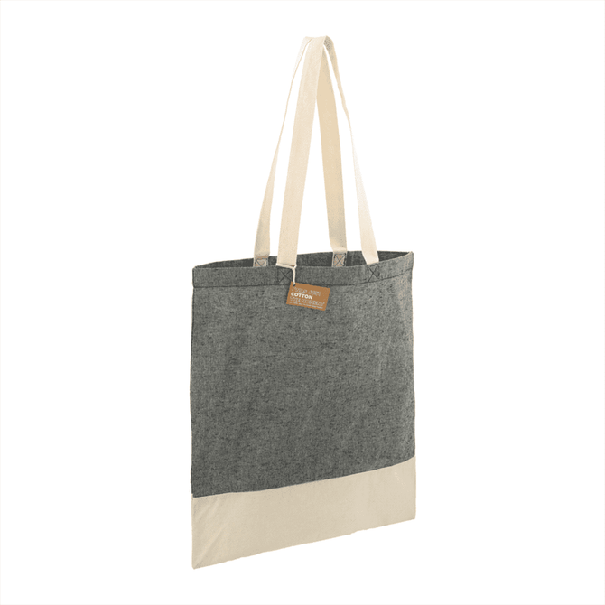 A recycled cotton twill tote bag in grey with a cream base and two sturdy handles. Features a logo tag.