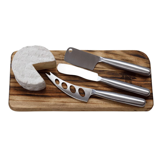 A cheese board featuring three stainless steel knives and a round wedge of cheese. The board is wooden.