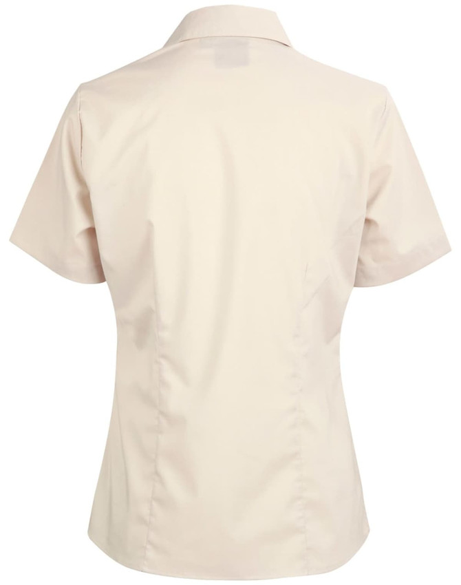 A beige short sleeve button-up shirt with a fitted design and a collar, featuring a logo on the back.