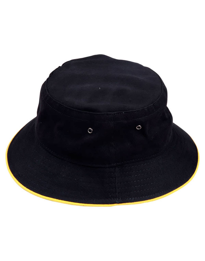 A black bucket hat featuring a contrasting yellow brim and eyelet details, with a logo on the side.