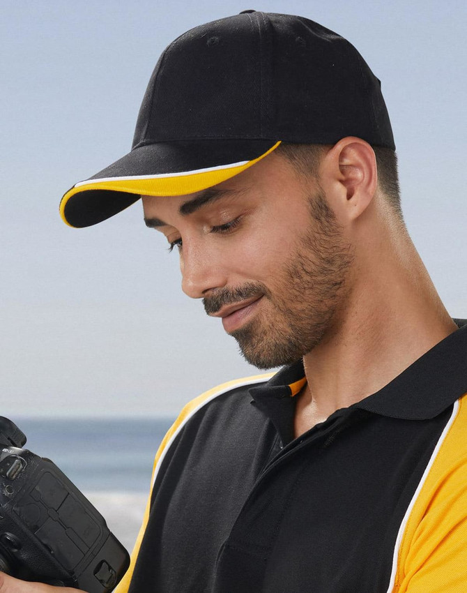 A red cap with a peak and contrasting black and white accents, featuring a logo.