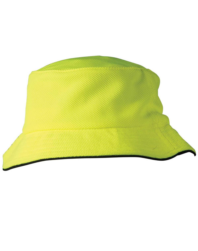 A bright yellow bucket hat with a black sandwich trim and a logo. Textured pique mesh material.