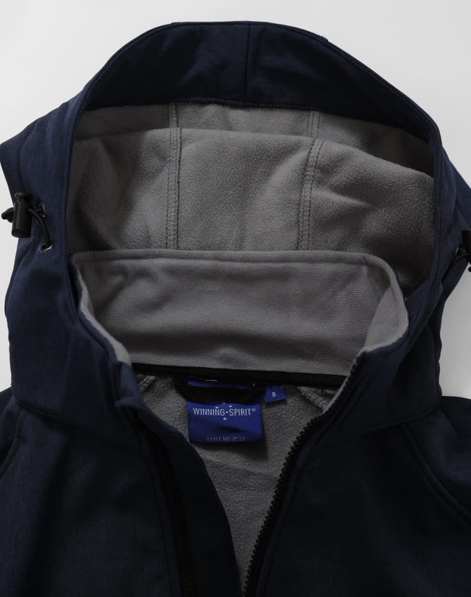 A navy softshell full zip hoodie with a grey fleece-lined interior and hood. Features a small logo inside.