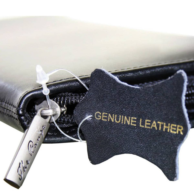 A black leather travel wallet featuring a zipper and a tag indicating genuine leather. It has a small branding logo.