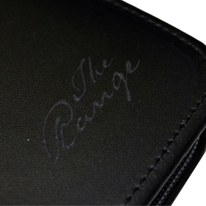 A black leather travel wallet with a subtle logo embossed on the surface.