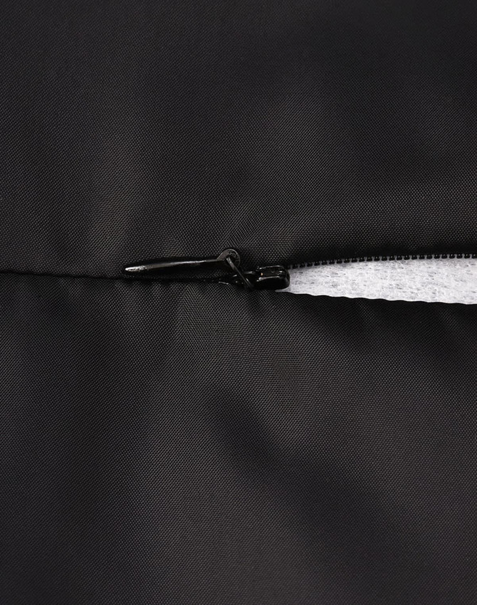 A close-up of a black parka jacket featuring a zipper and seamless design. It includes a logo on the fabric.