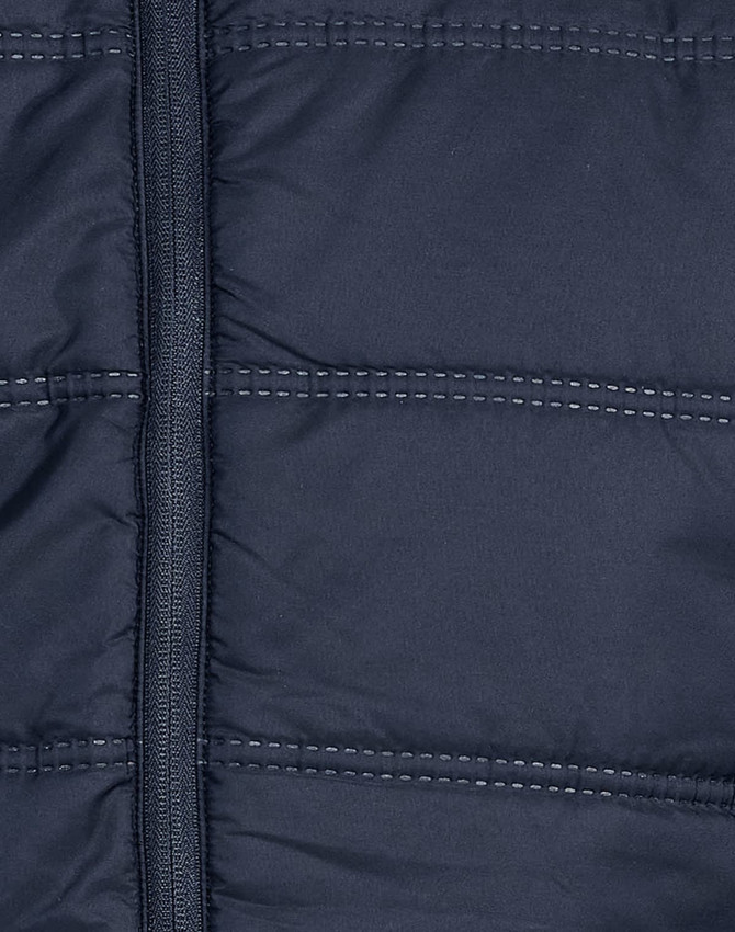 A navy blue unisex sustainable seamless parka jacket featuring a zip fastening and quilted texture.