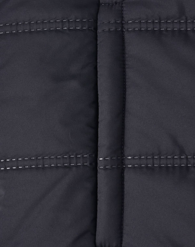A unisex sustainable seamless parka jacket in black, featuring a 3D cut with visible stitching details.