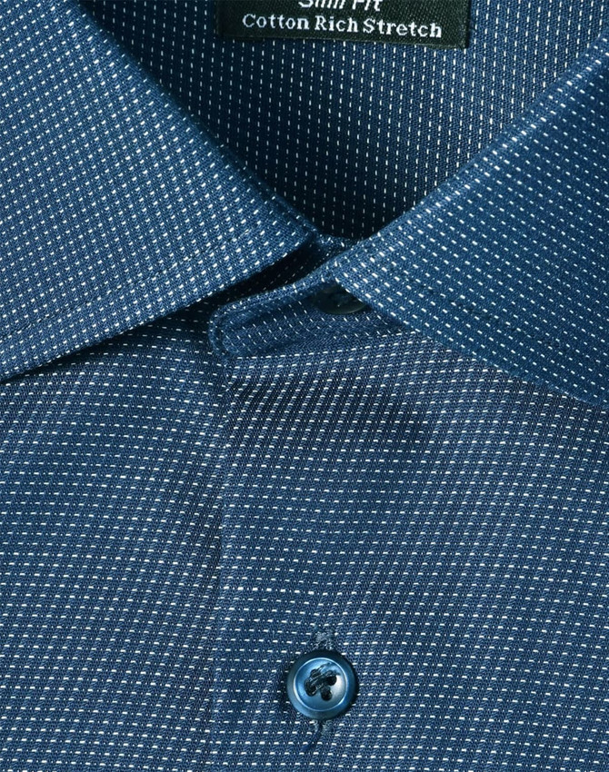 A close-up of a blue pin dot stretch button-up shirt featuring a patterned fabric and a branded tag.