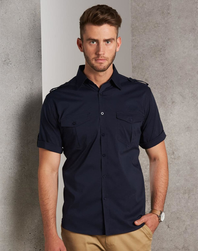 A men's short sleeve military shirt in navy with button-up front and two chest pockets, featuring a logo.