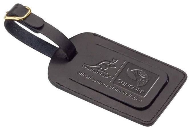A black covered luggage tag with a leather finish and two logos embossed on the surface.