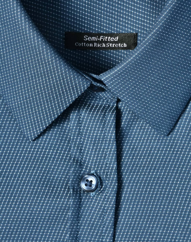 A semi-fitted, cotton-rich stretch shirt in blue featuring a pin dot pattern and button-up collar.