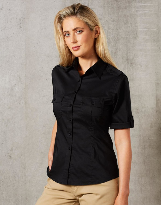 A short sleeve military shirt in black, featuring a button-up design and two front pockets.