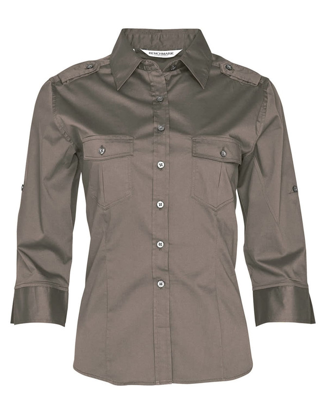 A khaki women's 3/4 sleeve military-style shirt featuring two front pockets and button-up detailing.