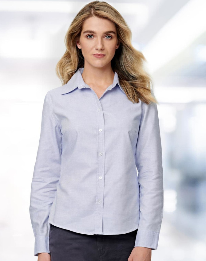 A light blue long sleeve button-up shirt for ladies, featuring a classic collar and a subtle textured pattern.