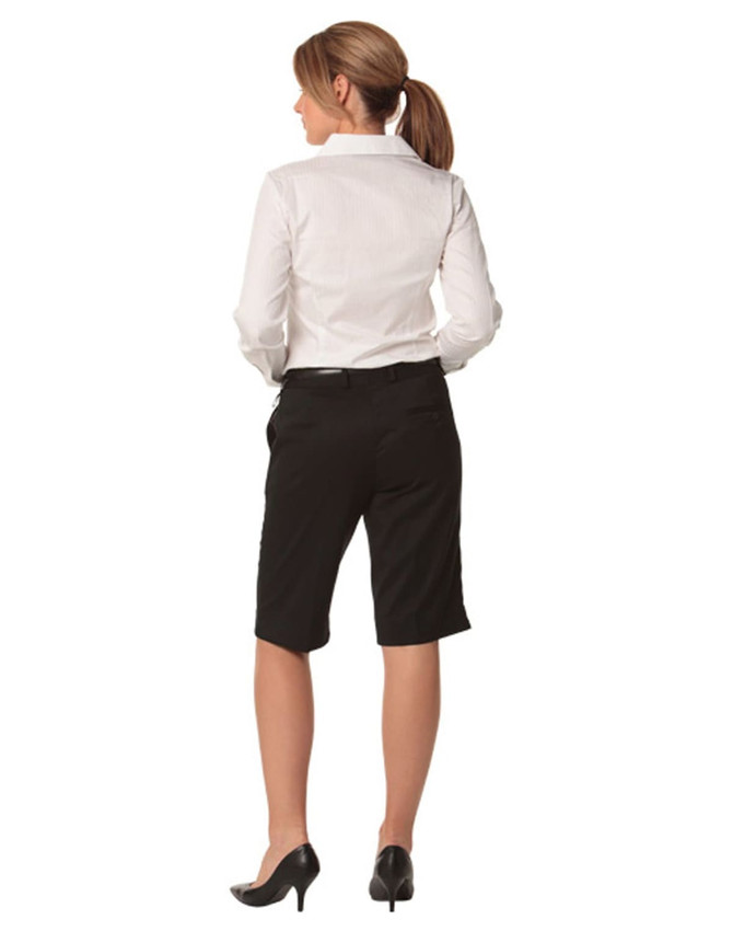 Knee-length black shorts with a flexi waist, shown from the back, paired with a white collared shirt.