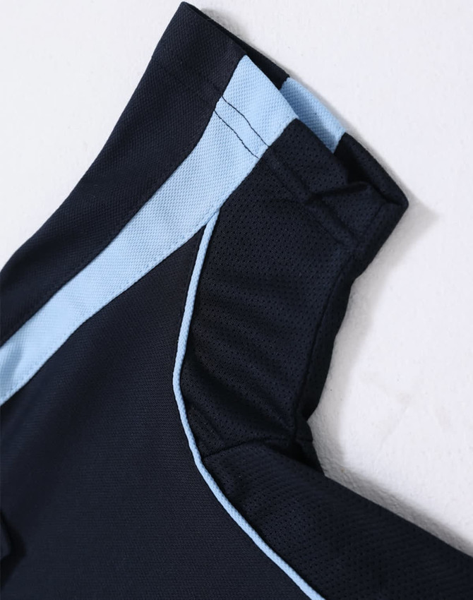A navy blue kids' polo shirt with light blue accents on the collar and shoulders, featuring a logo.