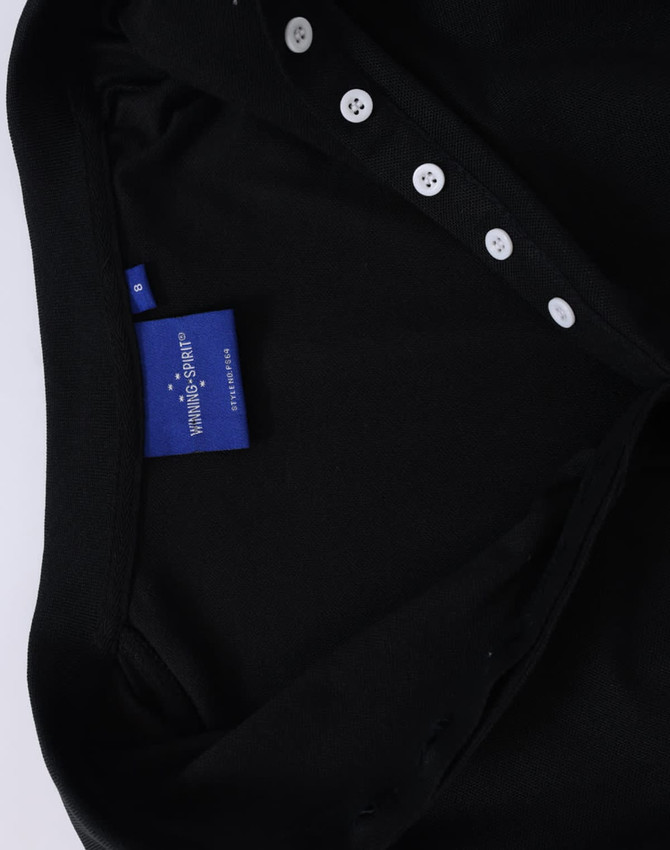 A black ladies' polo shirt featuring a collared neck and button details. It includes a label inside the collar.