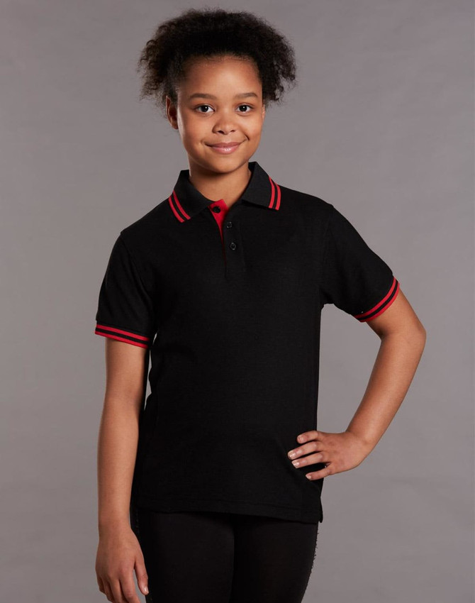 A black kids' polo shirt featuring red collar and sleeve trims, displaying a logo.