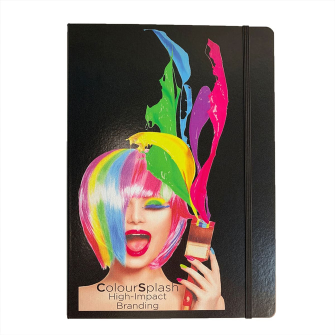 A large black journal with a colourful paint splash design and a model with a vibrant wig holding a brush.