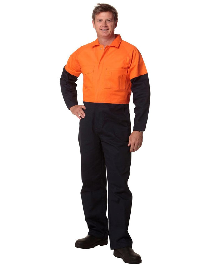 A man is wearing a Hi-Vis two-tone cotton drill coverall, featuring orange and navy blue colours. It has a logo.